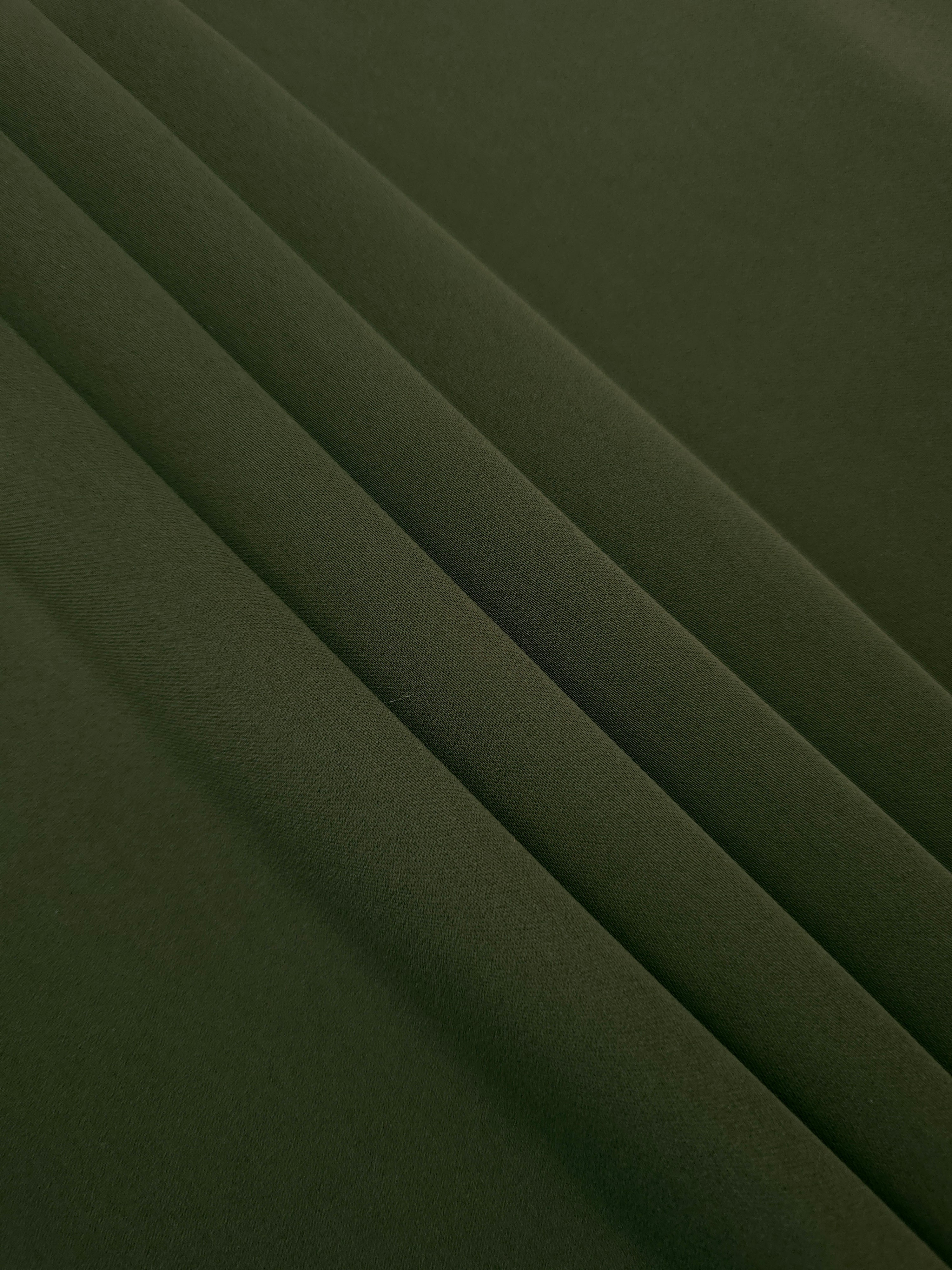 Deep Olive Green mechanical polyester crepe layered to show soft structure for tailored garments and separates