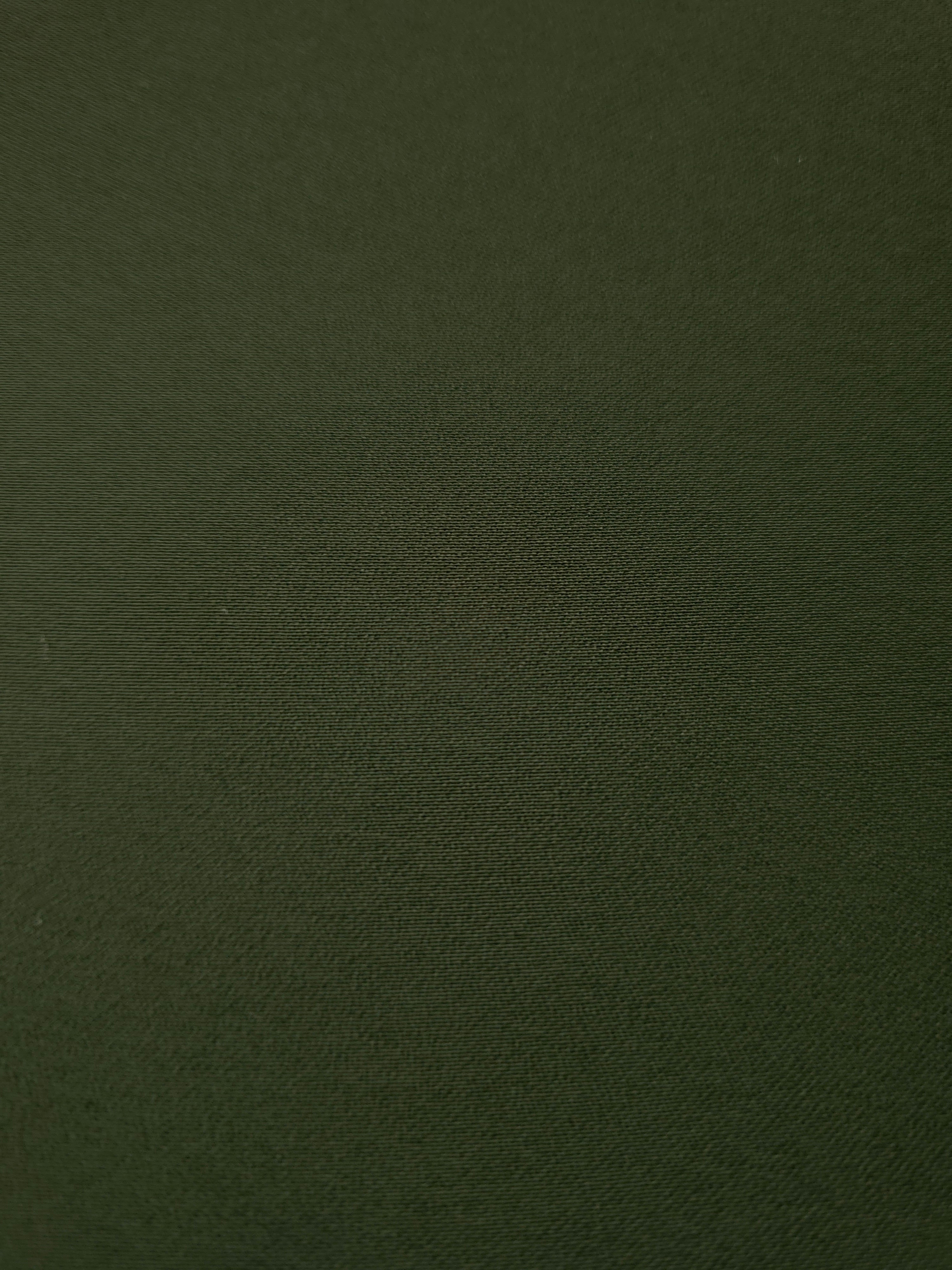 Close woven detail of Deep Olive Green 100% polyester Korean crepe showing its smooth texture and soft finish