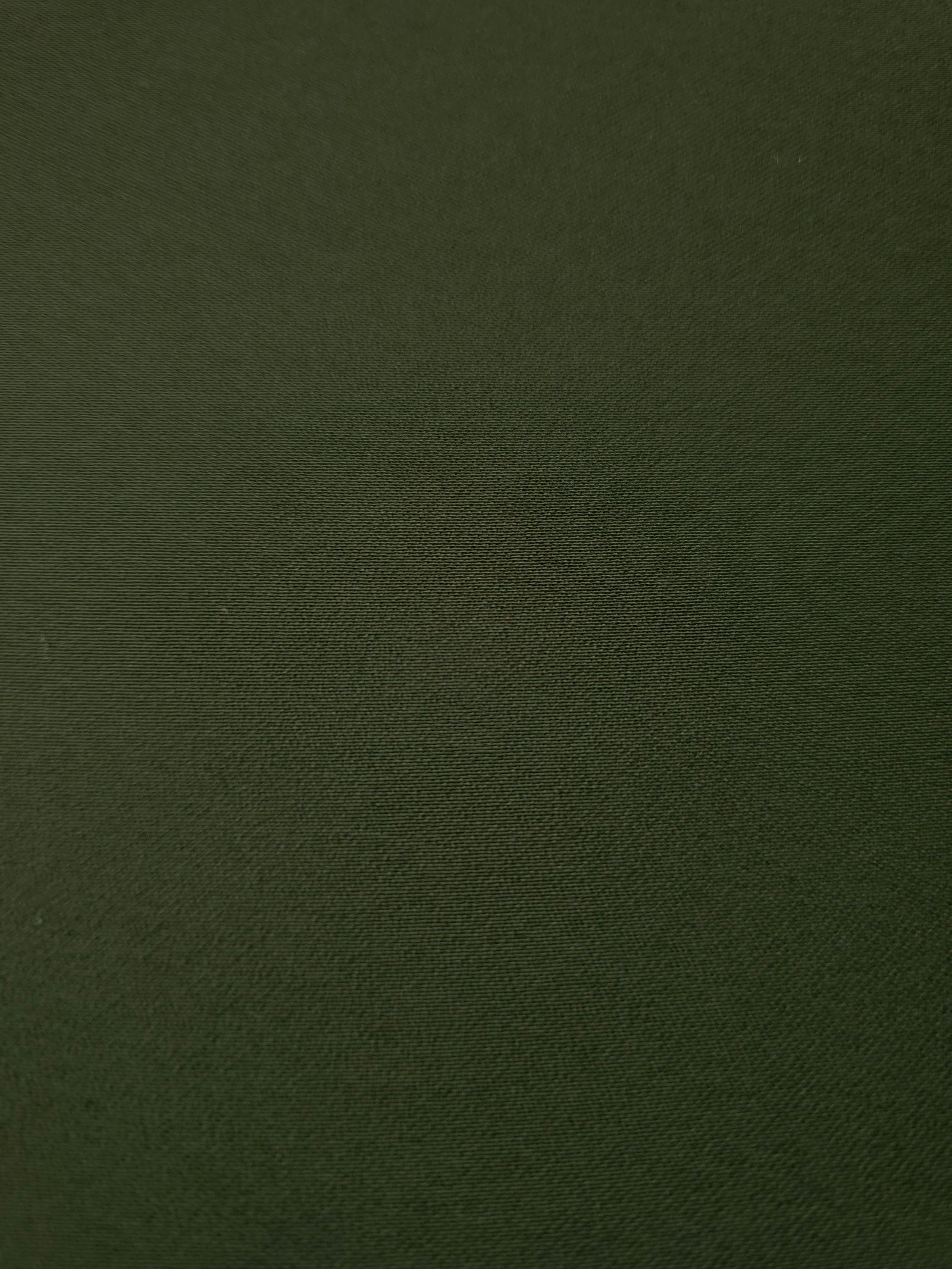 Close woven detail of Deep Olive Green 100% polyester Korean crepe showing its smooth texture and soft finish