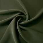 Flowing swirl of Deep Olive Green Korean polyester crepe showing soft drape for blouses, dresses and abayas
