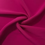 Draped Deep Raspberry Pink Korean polyester crepe showing opaque fluid folds for evening dresses and occasionwear