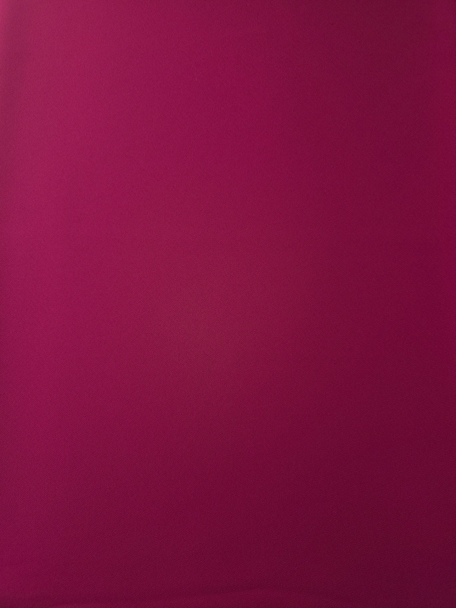 Deep Raspberry Pink 205 GSM Korean polyester crepe shown flat, an opaque smooth woven dress fabric with a silky-soft finish