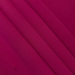 Deep Raspberry Pink polyester crepe arranged in a flowing swirl, showing drape used for abayas and modest fashion