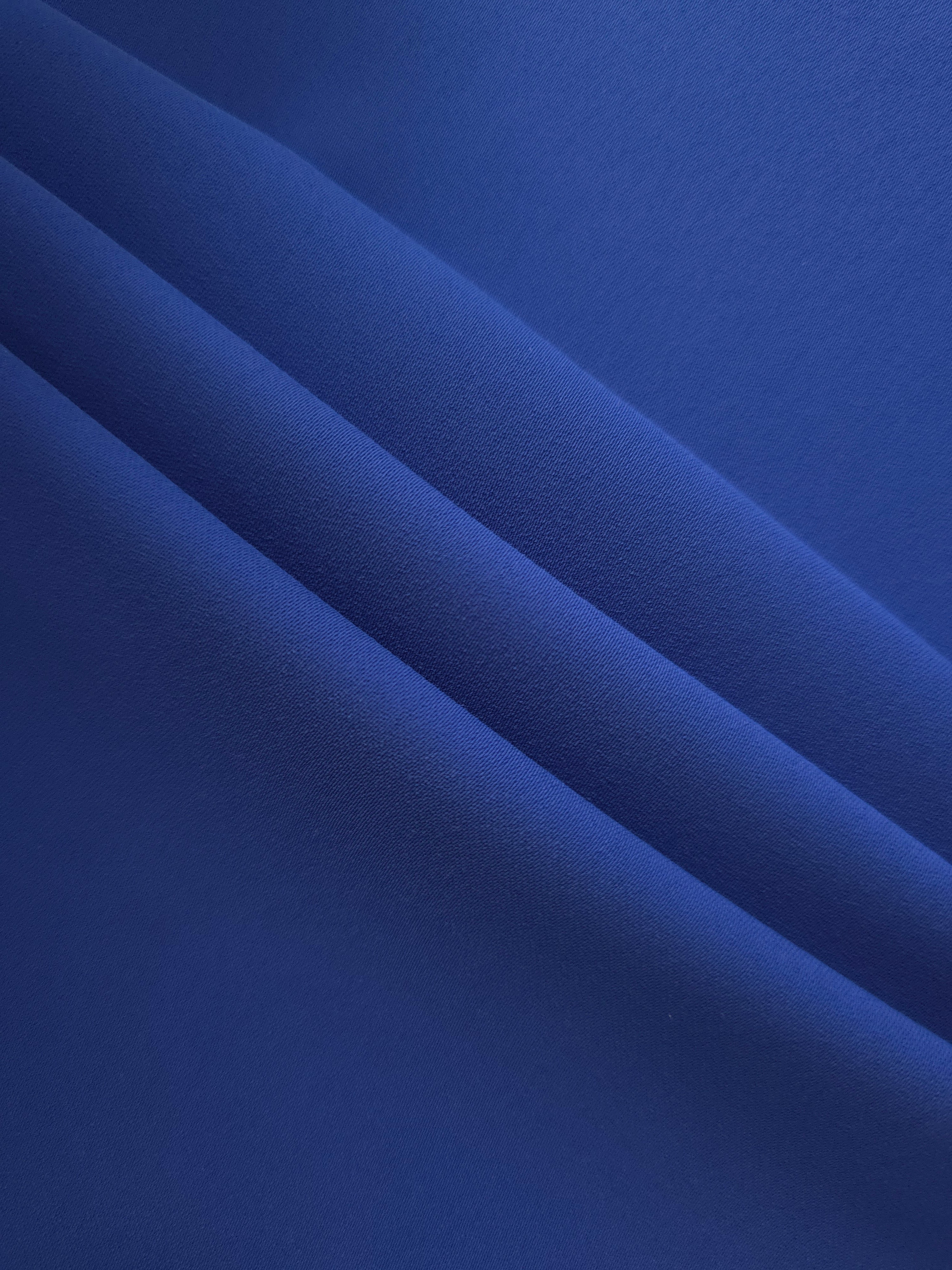 Deep Royal Blue mechanical polyester crepe layered to show soft structure for tailored garments and separates