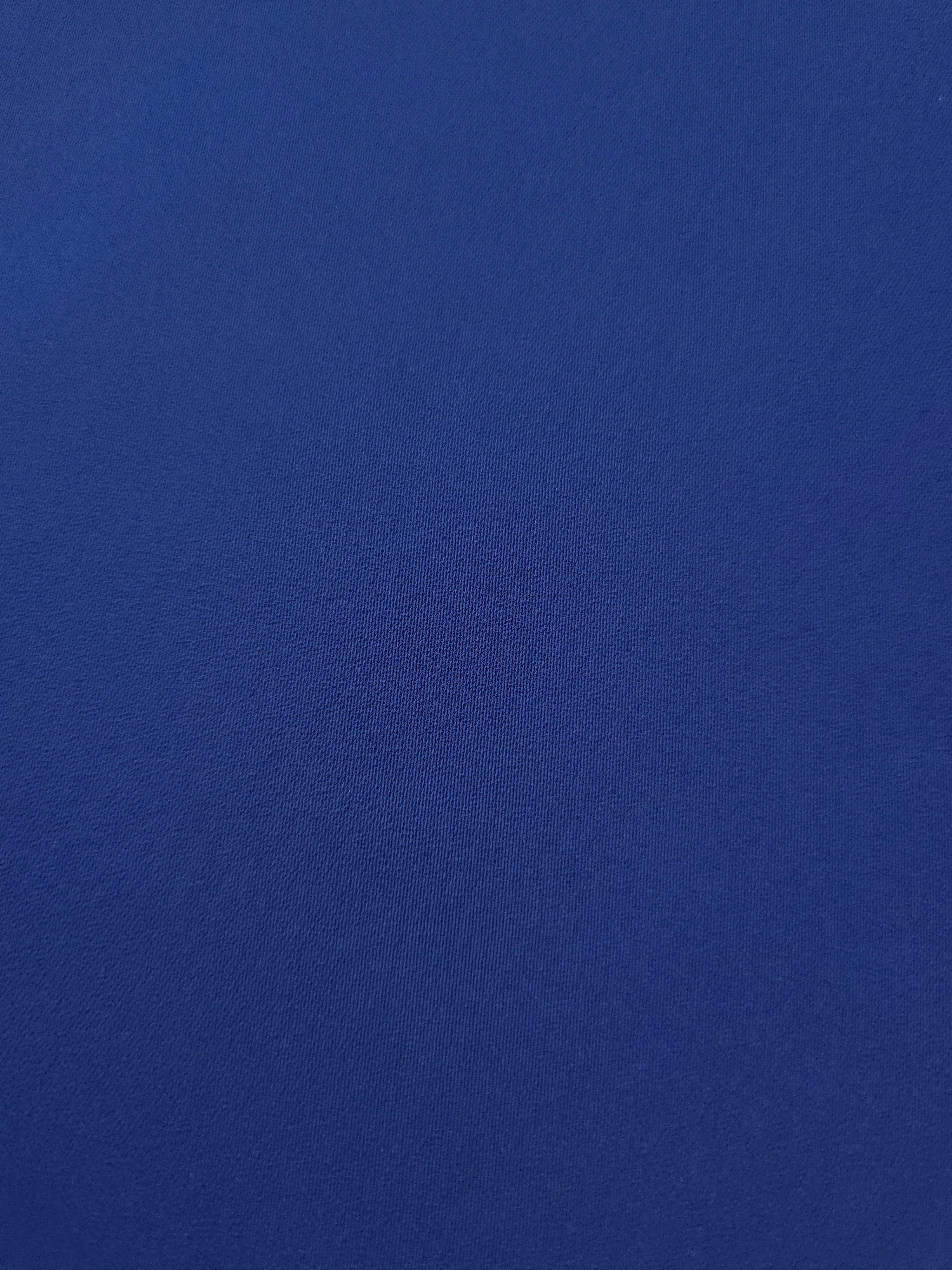 Close woven detail of Deep Royal Blue polyester crepe showing smooth texture and a refined silky-feel finish