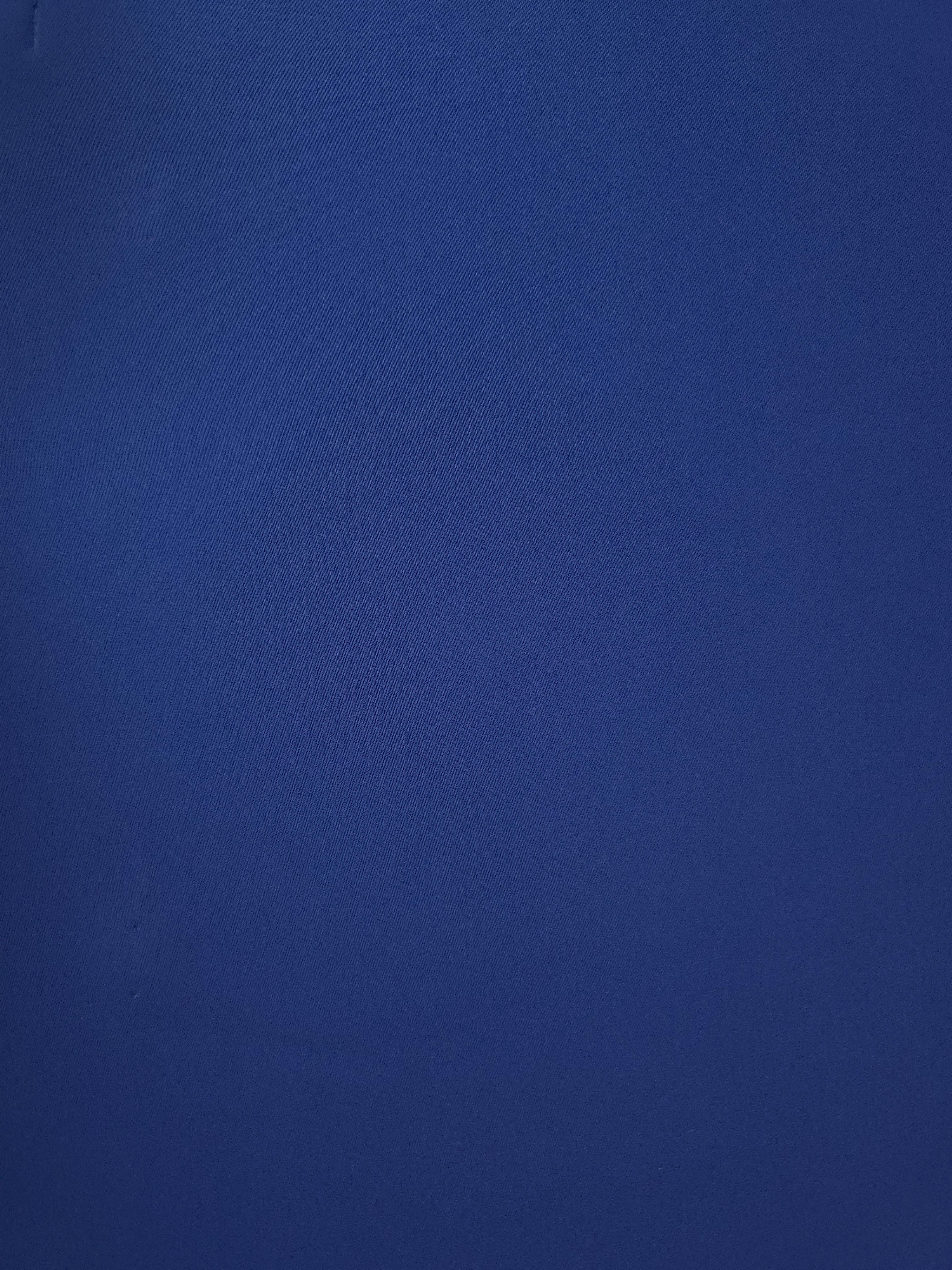 Surface view of Deep Royal Blue Italian polyester crepe, smooth woven fabric for dresses, blouses and separates