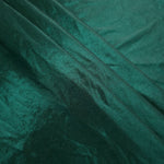 Layered Deep Teal Green shimmer stretch fabric showing metallic foil depth and soft structure for costumes, skirts and fashion apparel