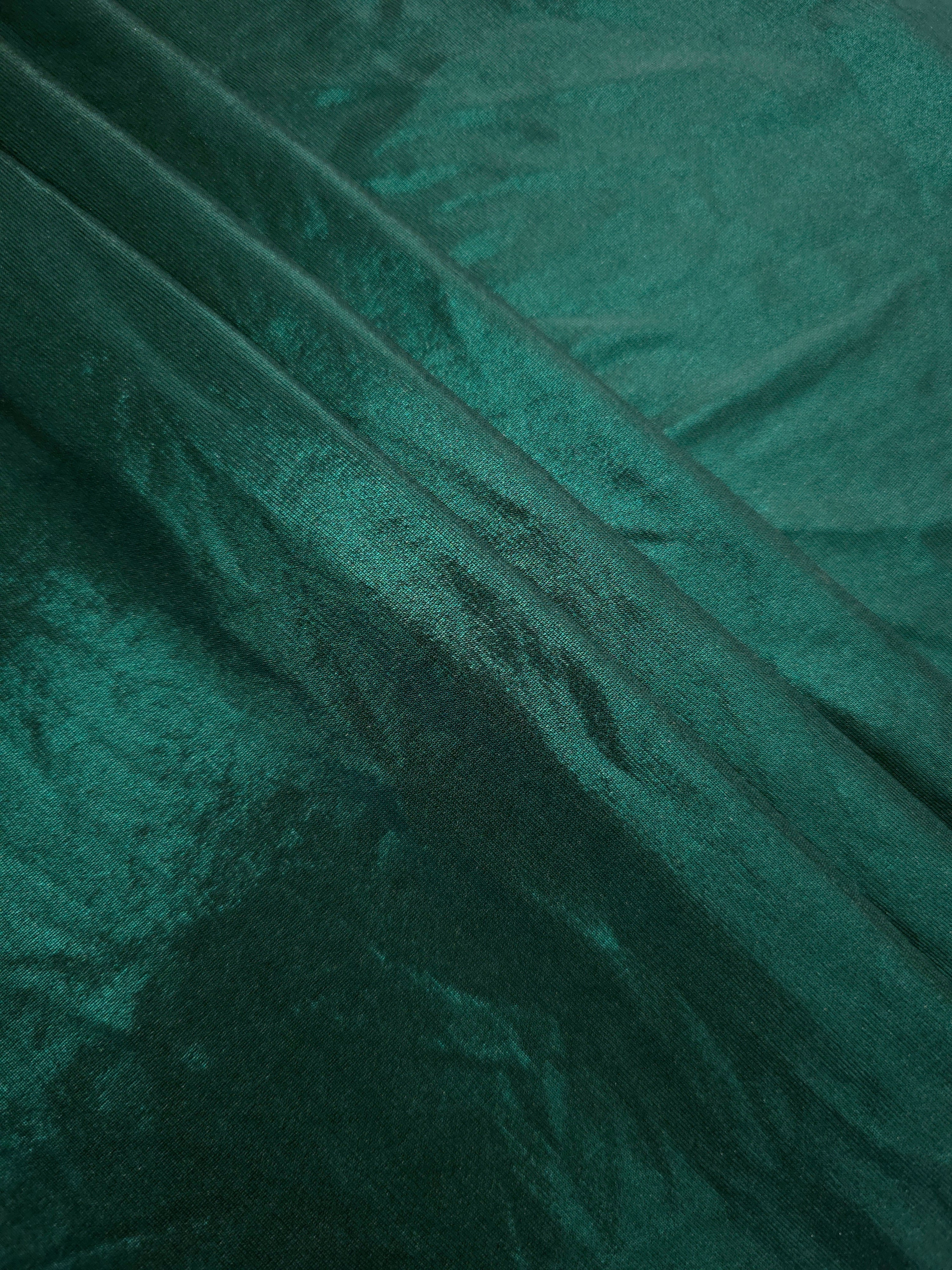 Layered Deep Teal Green shimmer stretch fabric showing metallic foil depth and soft structure for costumes, skirts and fashion apparel