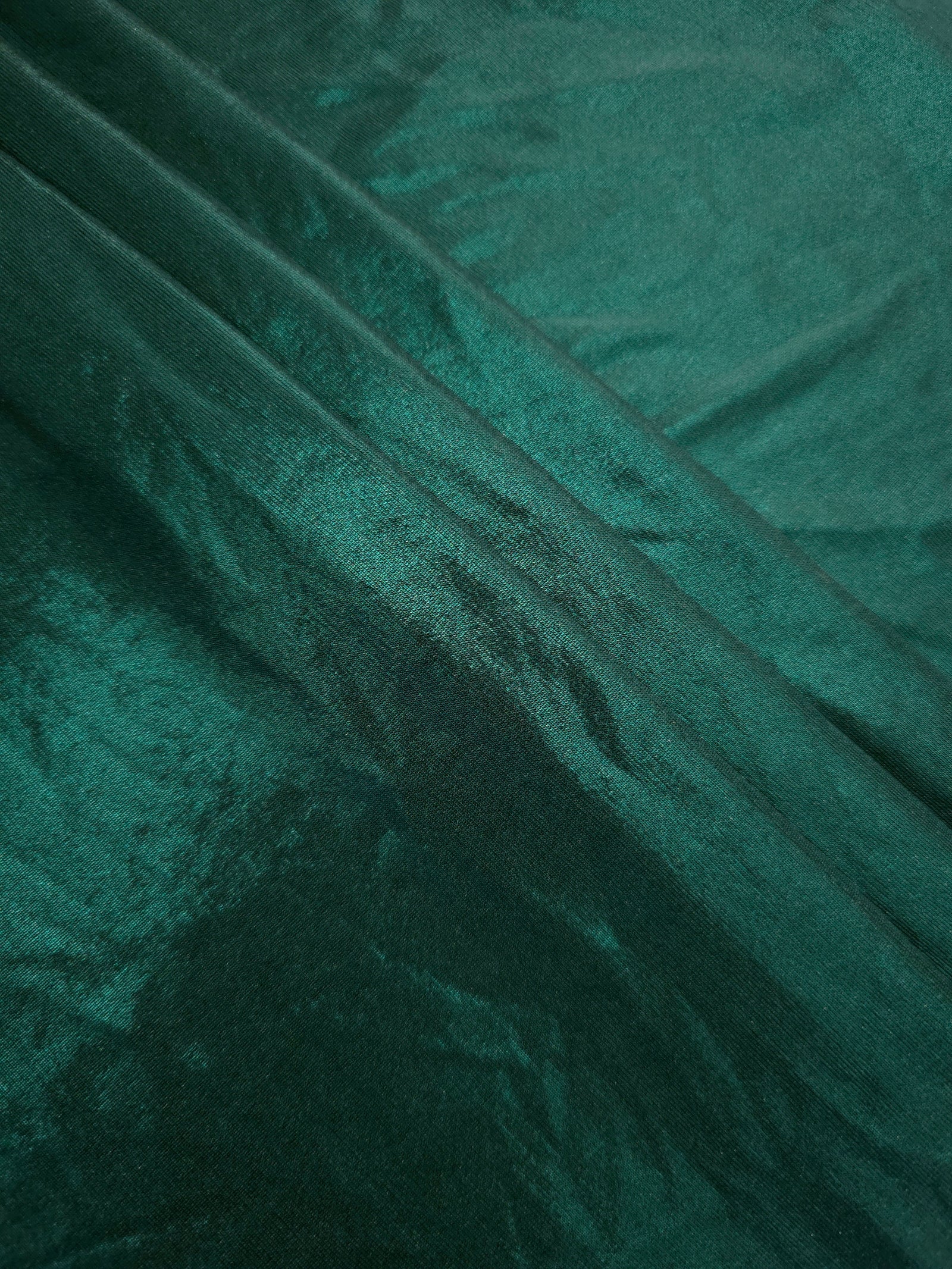 Layered Deep Teal Green shimmer stretch fabric showing metallic foil depth and soft structure for costumes, skirts and fashion apparel