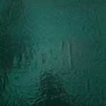 Deep Teal Green metallic foiled spandex shown flat, reflective stretch fabric for dancewear, eveningwear and statement garments