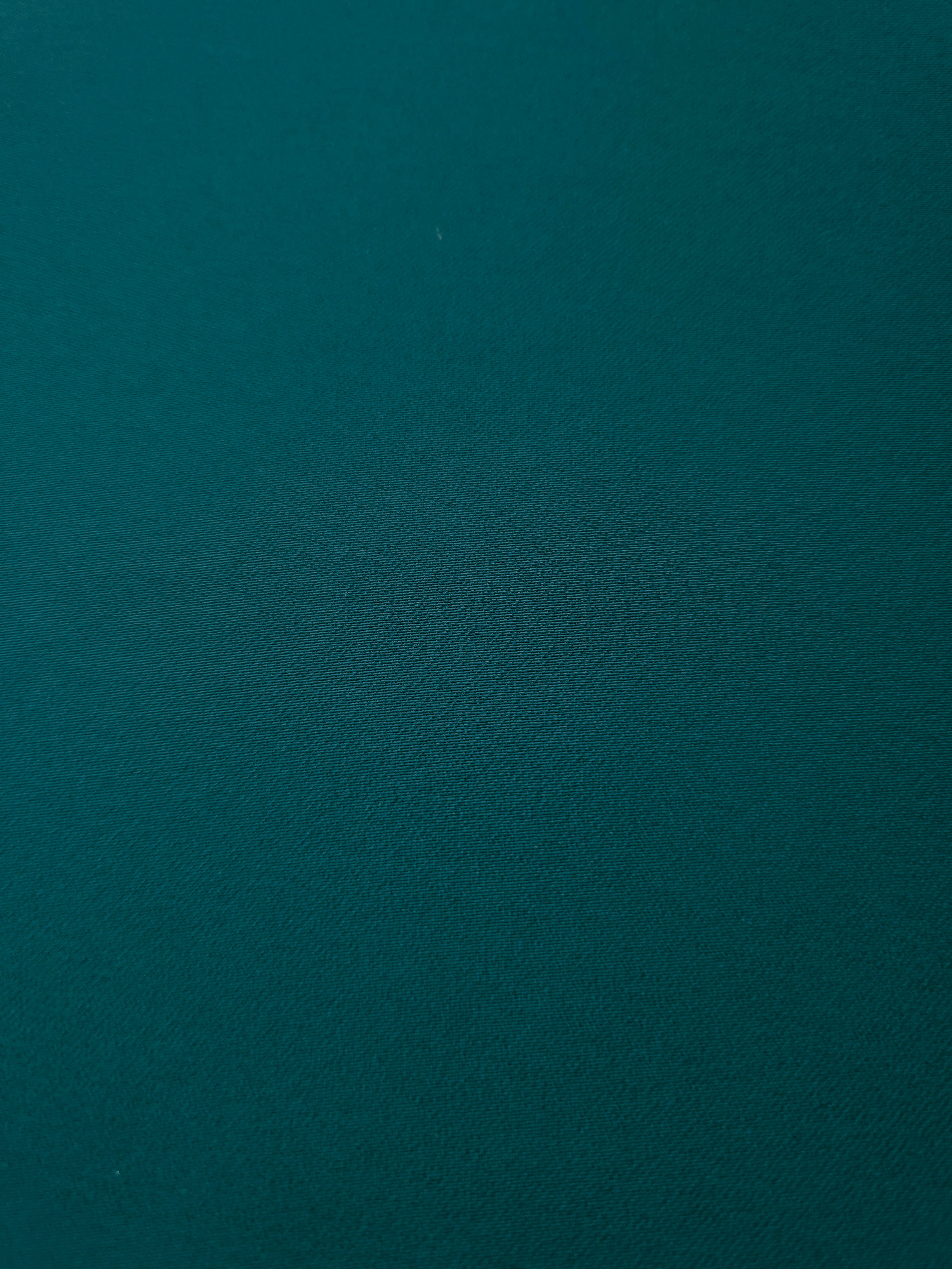 Deep Teal mechanical polyester crepe in close-up, showing fine woven texture and a silky-soft surface