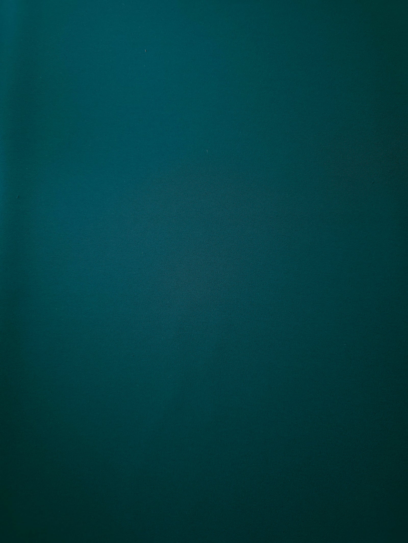 Deep Teal opaque Korean polyester crepe shown flat, 205 GSM smooth woven fabric for dressmaking