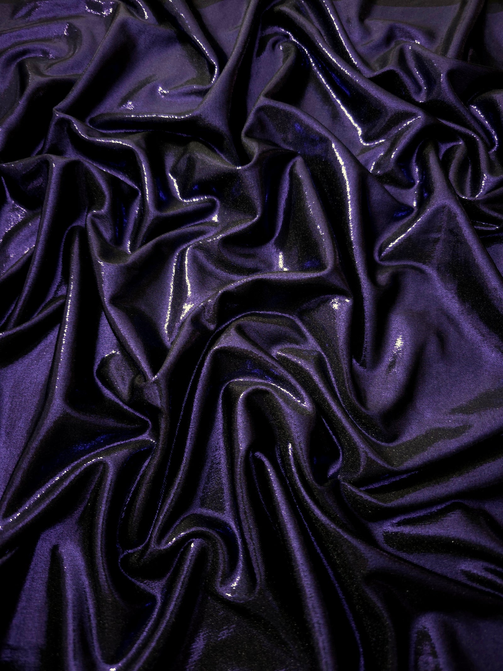 Draped Deep Violet Purple shimmer spandex fabric with luminous foil reflection, suited to gowns, skirts and theatrical apparel