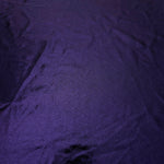 Full surface of Deep Violet Purple metallic stretch fabric, highlighting luminous foil sheen for stage costumes, dresses and fashion design
