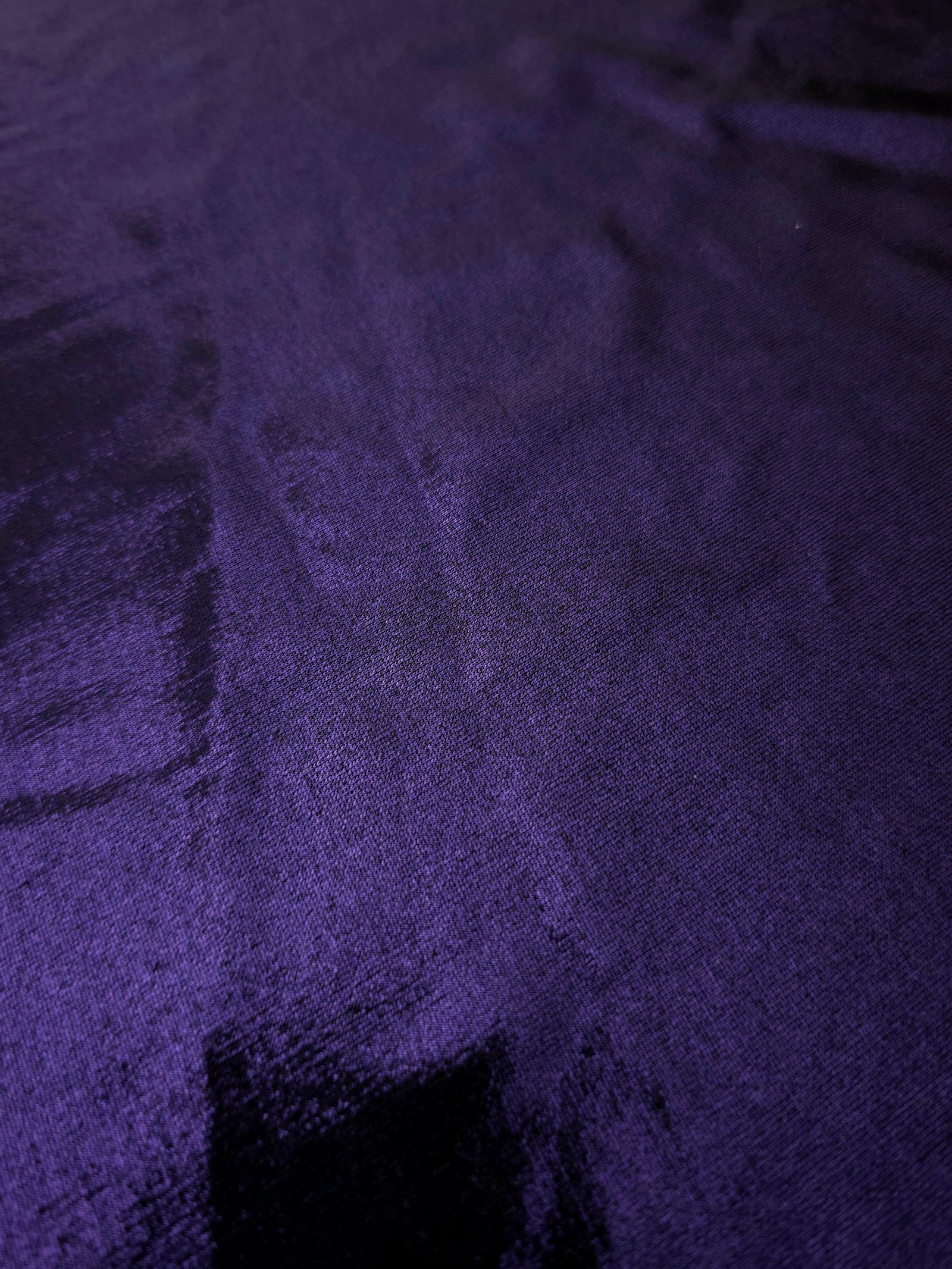 Texture view of Deep Violet Purple metallic stretch fabric, highlighting foil shimmer and surface detail for performance apparel