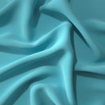 Long draped folds of Dusty Aqua Blue Korean crepe showing opaque coverage for abayas, dresses and modest wear