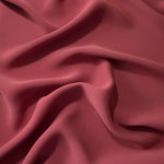 Fluid folds of Dusty Burgundy opaque Korean crepe, a dress fabric suited to eveningwear and flowing skirts