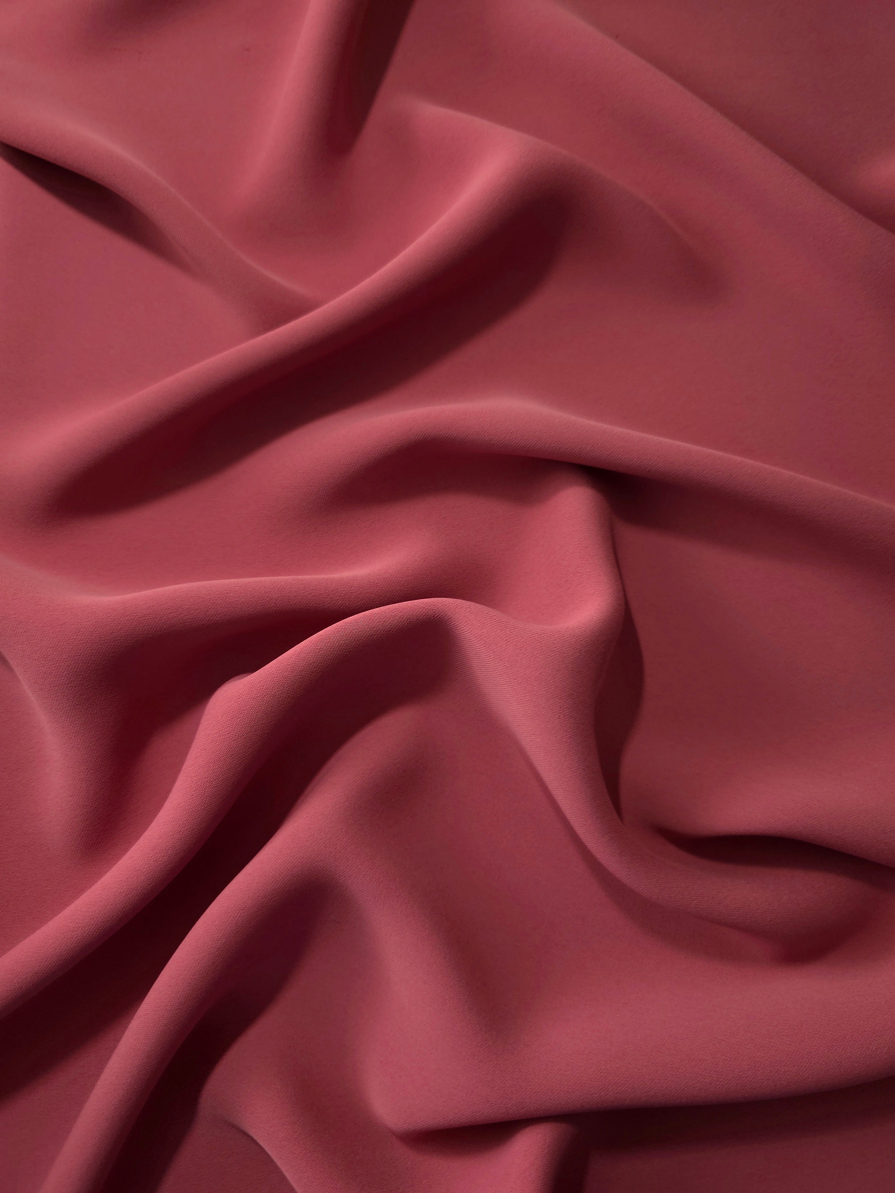 Fluid folds of Dusty Burgundy opaque Korean crepe, a dress fabric suited to eveningwear and flowing skirts