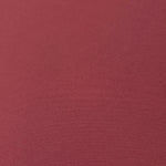 Texture detail of Dusty Burgundy mechanical polyester crepe, a smooth woven fabric with a soft silky hand