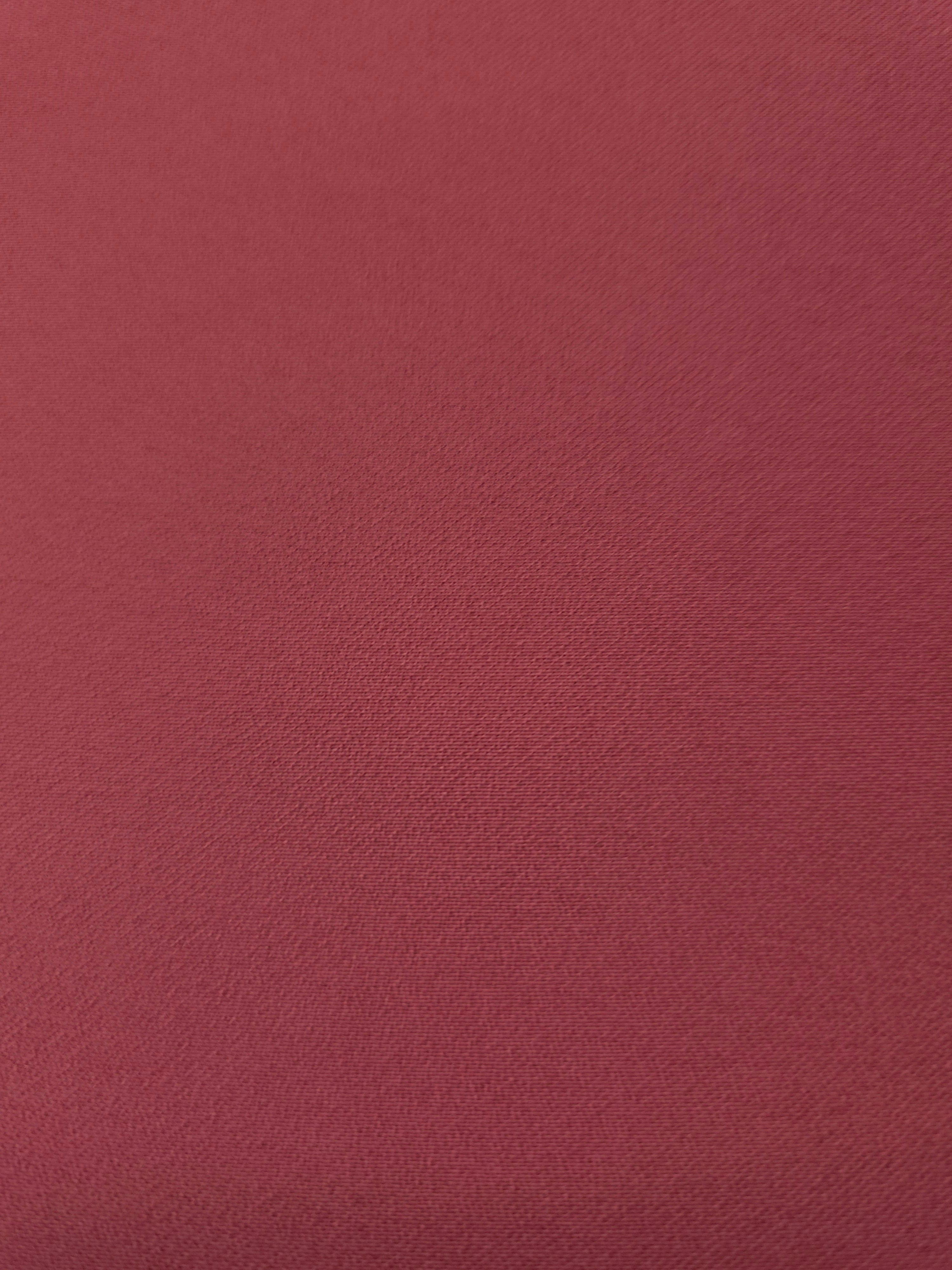 Texture detail of Dusty Burgundy mechanical polyester crepe, a smooth woven fabric with a soft silky hand