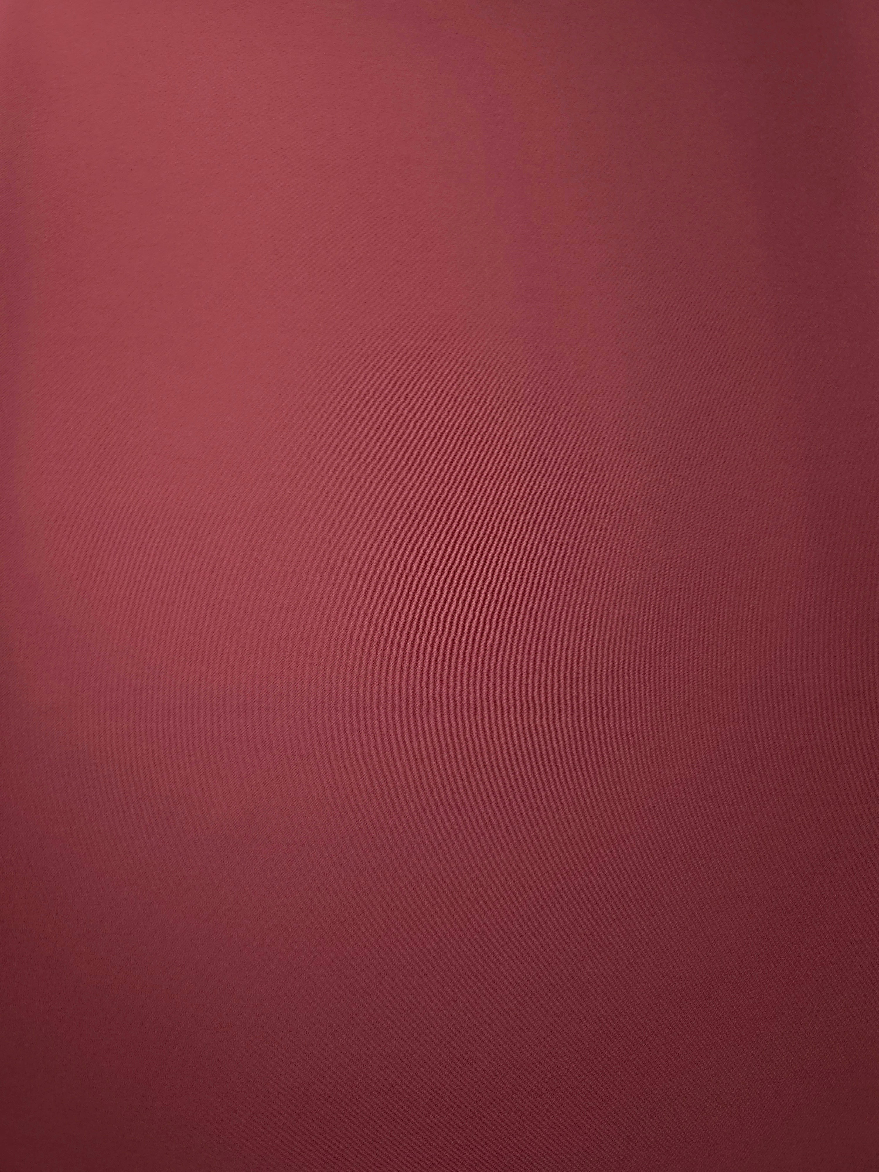 Dusty Burgundy Korean crepe fabric shown flat, 205 GSM opaque polyester with a smooth surface and silky-soft hand