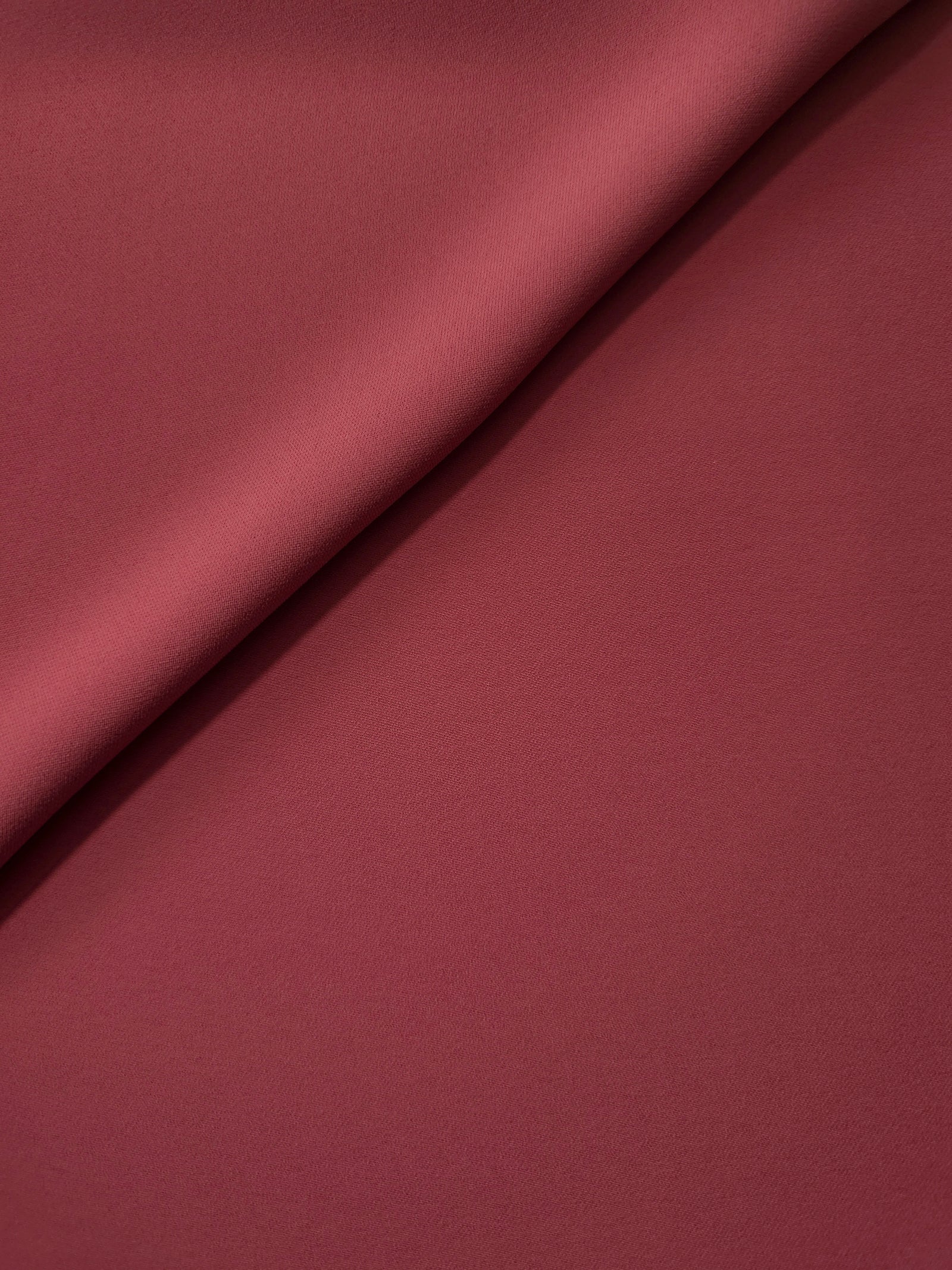 Dusty Burgundy silky-soft Korean crepe folded loosely to show fluid drape for blouses and occasionwear separates