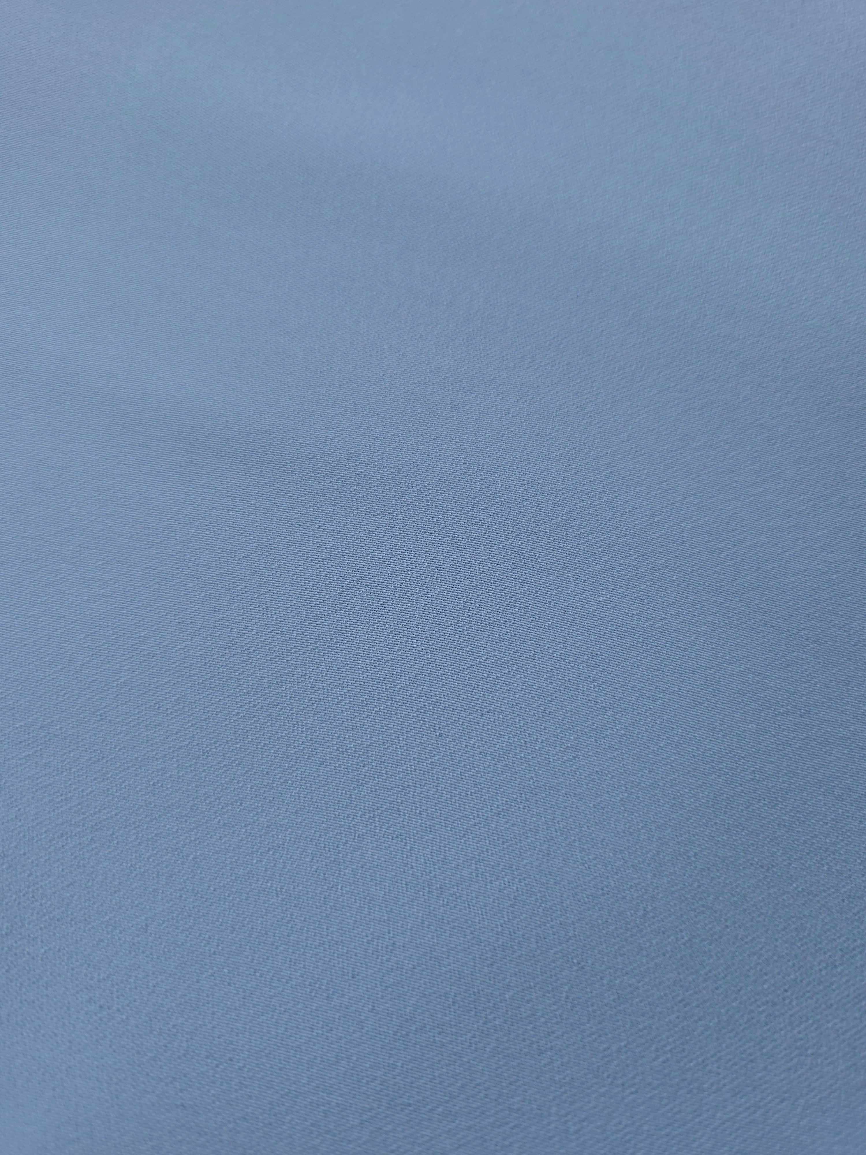 Texture detail of Dusty Denim Blue mechanical polyester crepe, showing a fine weave and silky-soft surface