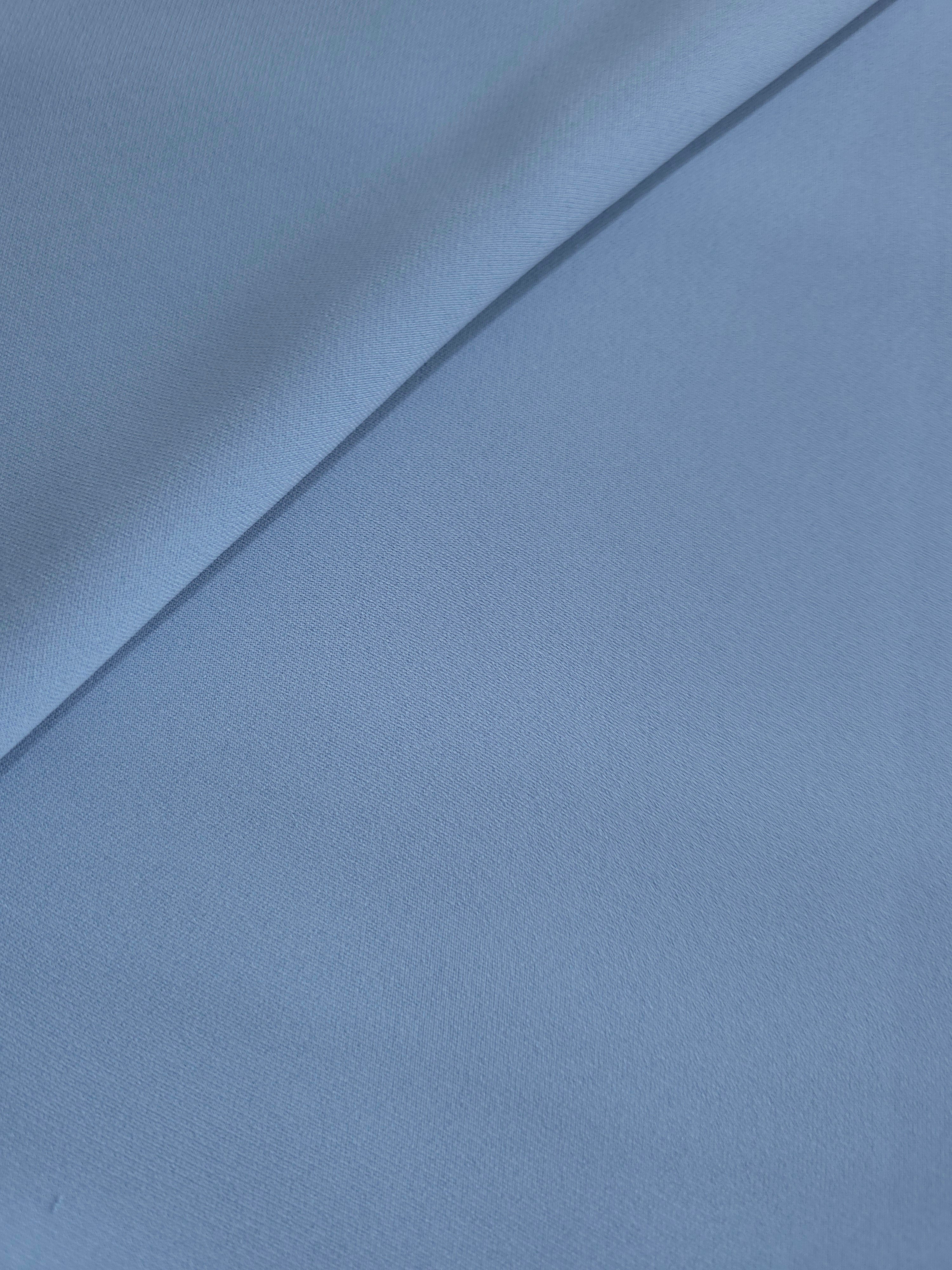 Dusty Denim Blue silky-feel crepe folded loosely to show fluid drape for blouses and elegant separates