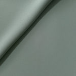 Dusty Eucalyptus Green Korean polyester crepe in a soft fold, showing fluid drape for blouses and flowing dresses