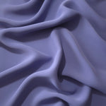 Fluid folds of Dusty Indigo Blue opaque Korean crepe, a dress fabric suited to eveningwear and flowing skirts
