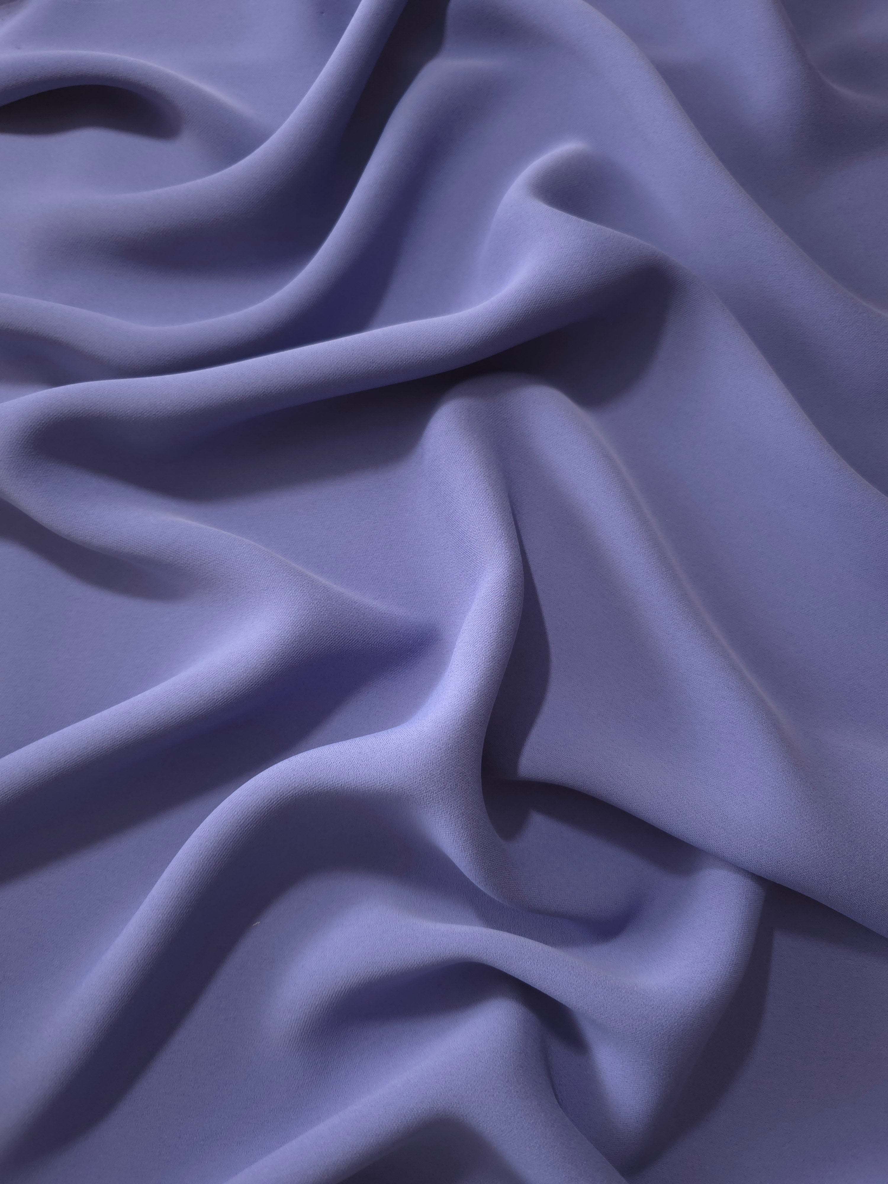 Fluid folds of Dusty Indigo Blue opaque Korean crepe, a dress fabric suited to eveningwear and flowing skirts