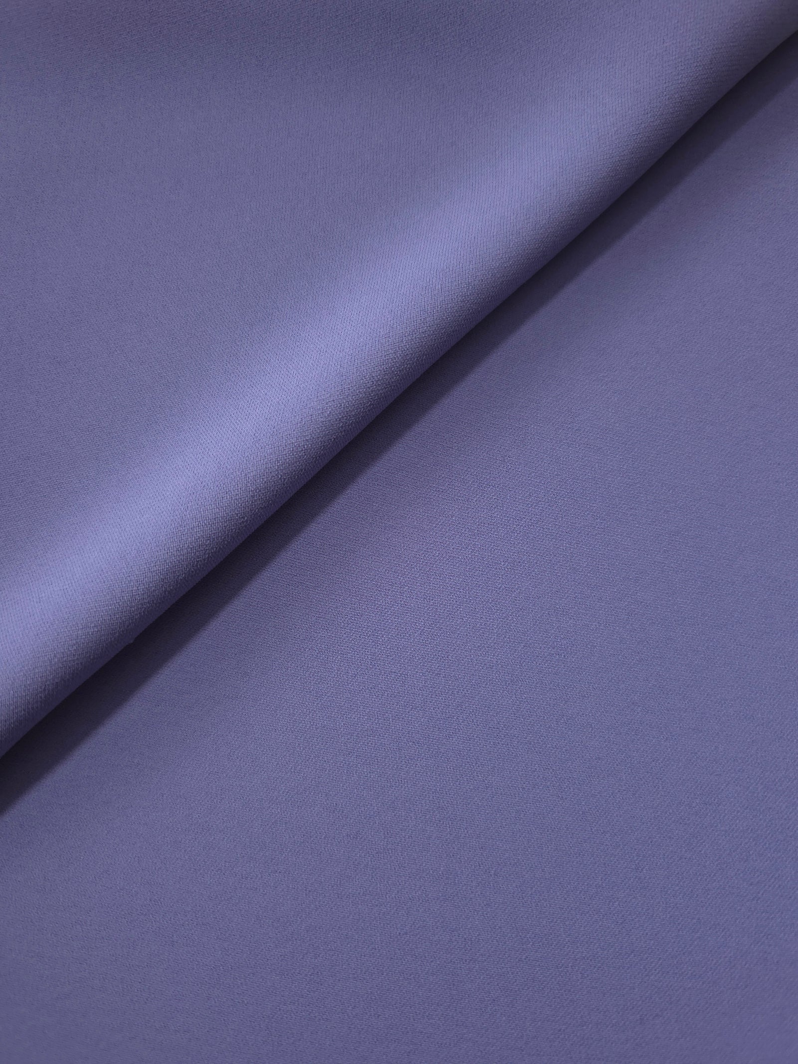 Dusty Indigo Blue silky-soft Korean crepe folded loosely to show fluid drape for blouses and occasionwear separates