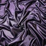 Softly draped Dusty Lavender Purple foiled spandex fabric showing fluid shape and metallic shimmer for dresses, stage costumes and eventwear