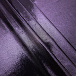 Dusty Lavender Purple foiled spandex arranged in layered folds, displaying shimmer and soft structure for skirts, tops and performancewear