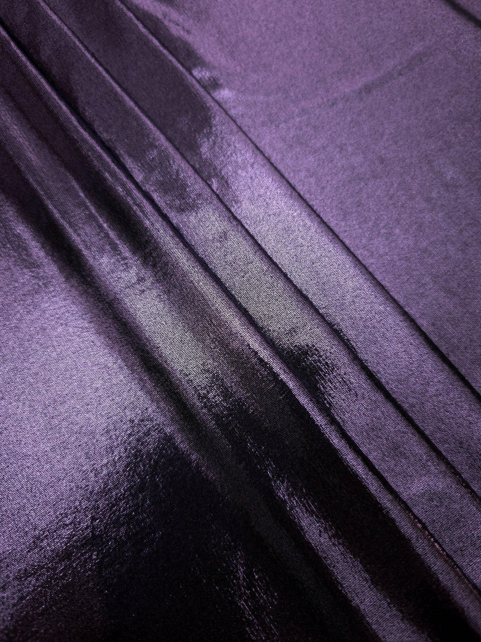 Dusty Lavender Purple foiled spandex arranged in layered folds, displaying shimmer and soft structure for skirts, tops and performancewear