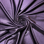Flowing swirl of Dusty Lavender Purple metallic stretch fabric, showing dynamic foil reflection for stagewear, skirts and creative fashion