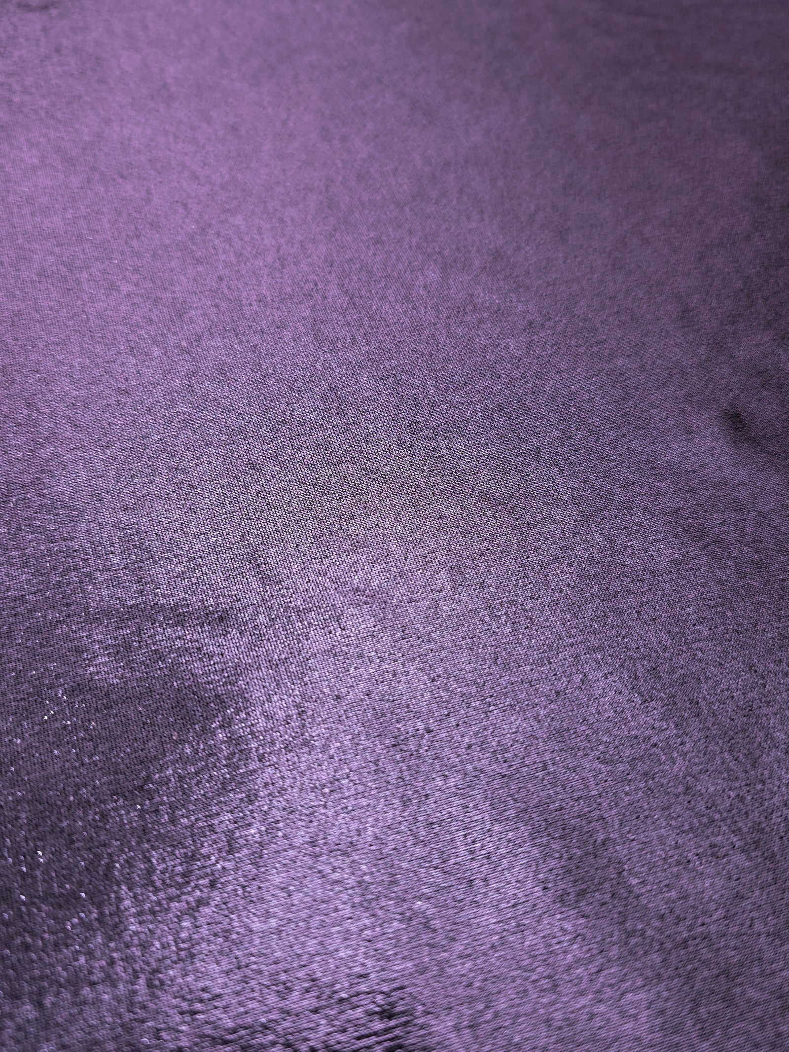 Dusty Lavender Purple foiled stretch fabric texture close-up, displaying metallic reflection and fine surface character for apparel design