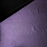 Softly folded Dusty Lavender Purple foiled spandex showing metallic shine and flexible hand for costumes, eveningwear and creative sewing