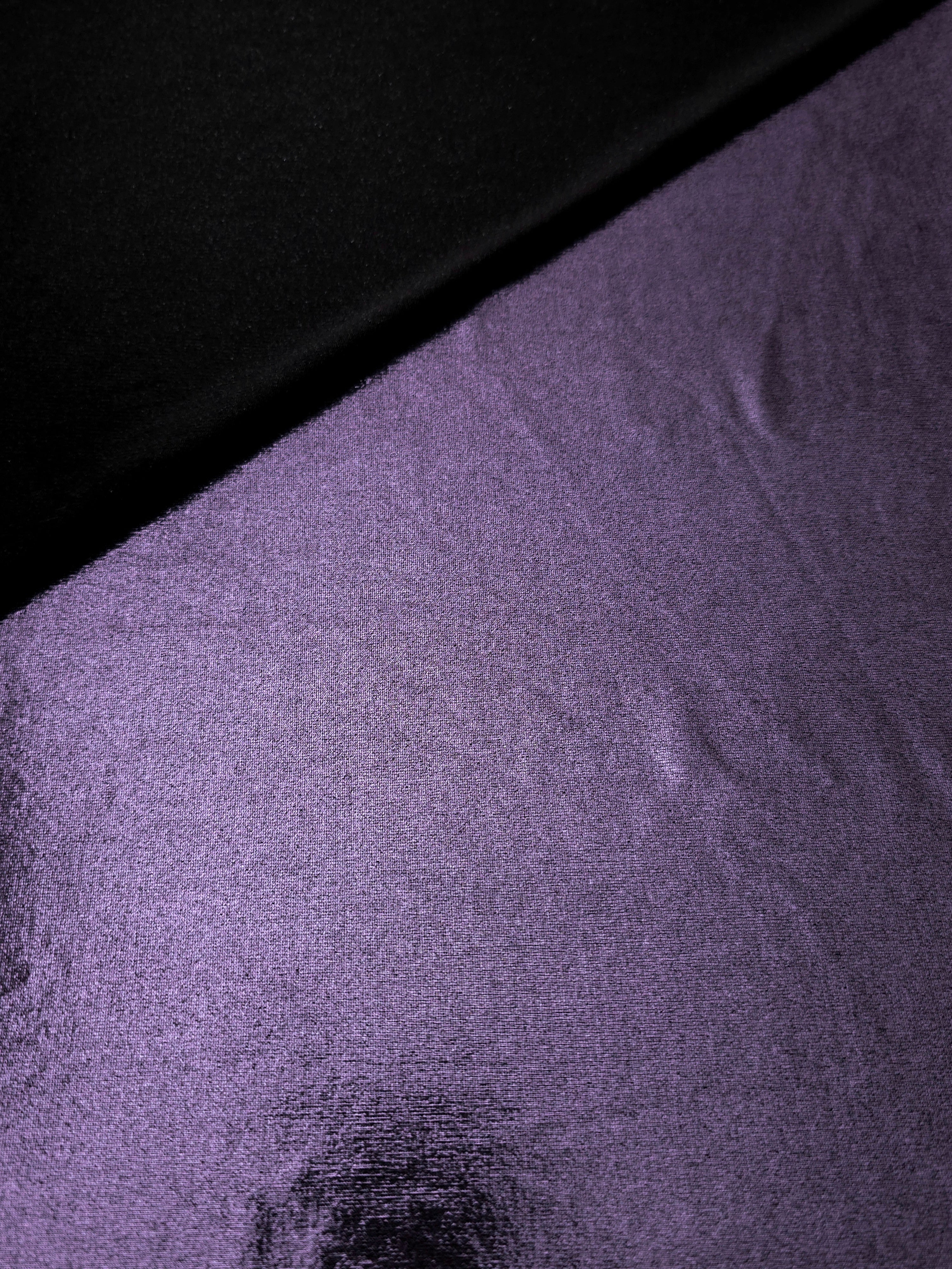 Softly folded Dusty Lavender Purple foiled spandex showing metallic shine and flexible hand for costumes, eveningwear and creative sewing