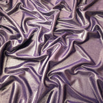 Flowing folds of Dusty Mauve Gray metallic foiled spandex, showing shimmer and drape for dancewear, party dresses and performance fashion