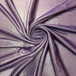 Dusty Mauve Gray metallic stretch fabric in a flowing swirl, emphasizing foil shimmer and drape for partywear and statement fashion