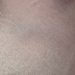 Close-up of Dusty Mauve Gray metallic foiled spandex showing reflective surface texture and the detailed shimmer finish