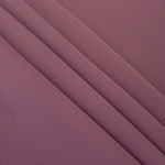 Layered Dusty Mauve Korean polyester crepe showing gentle mechanical stretch and soft structure for dressmaking