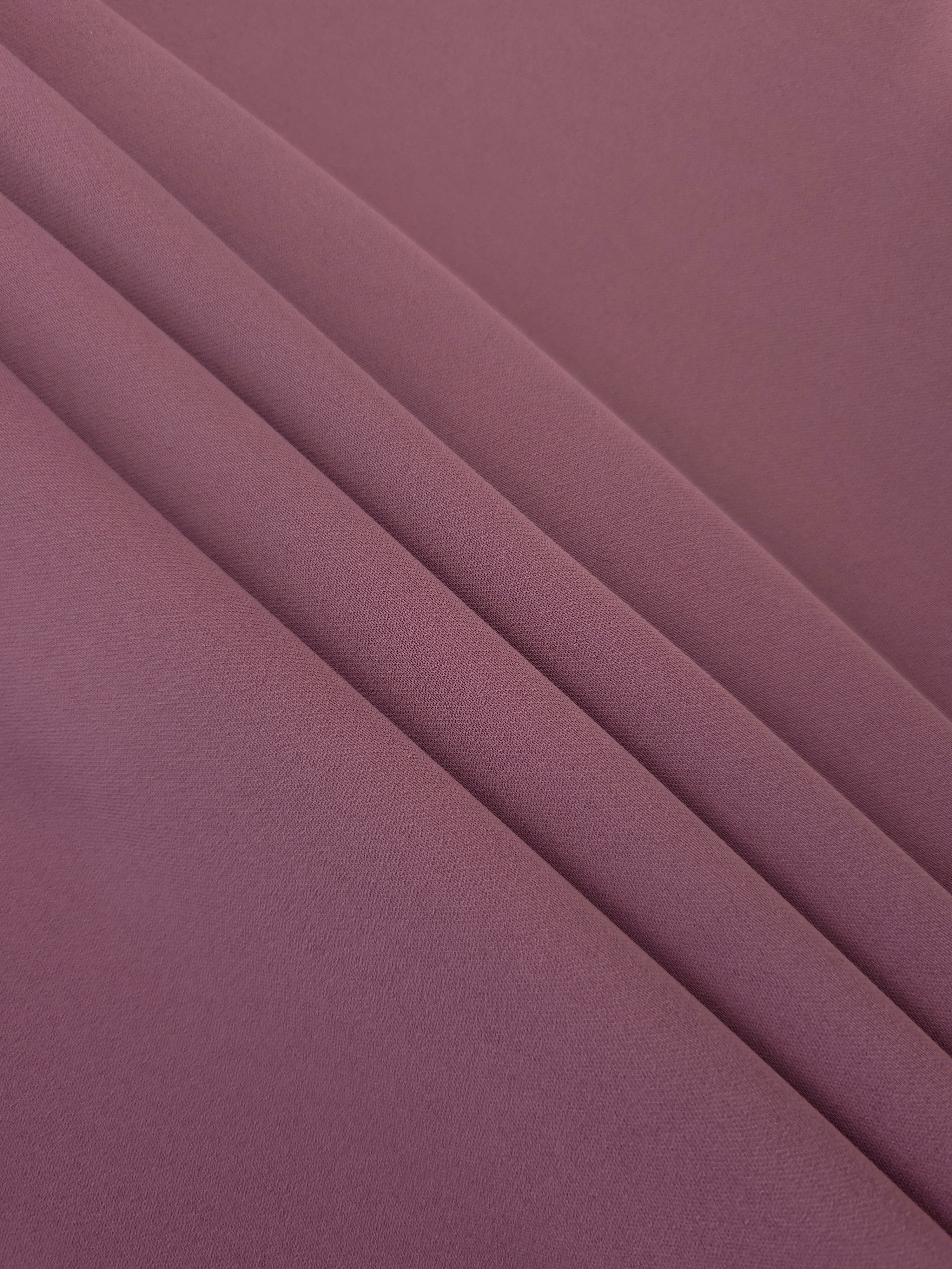 Layered Dusty Mauve Korean polyester crepe showing gentle mechanical stretch and soft structure for dressmaking
