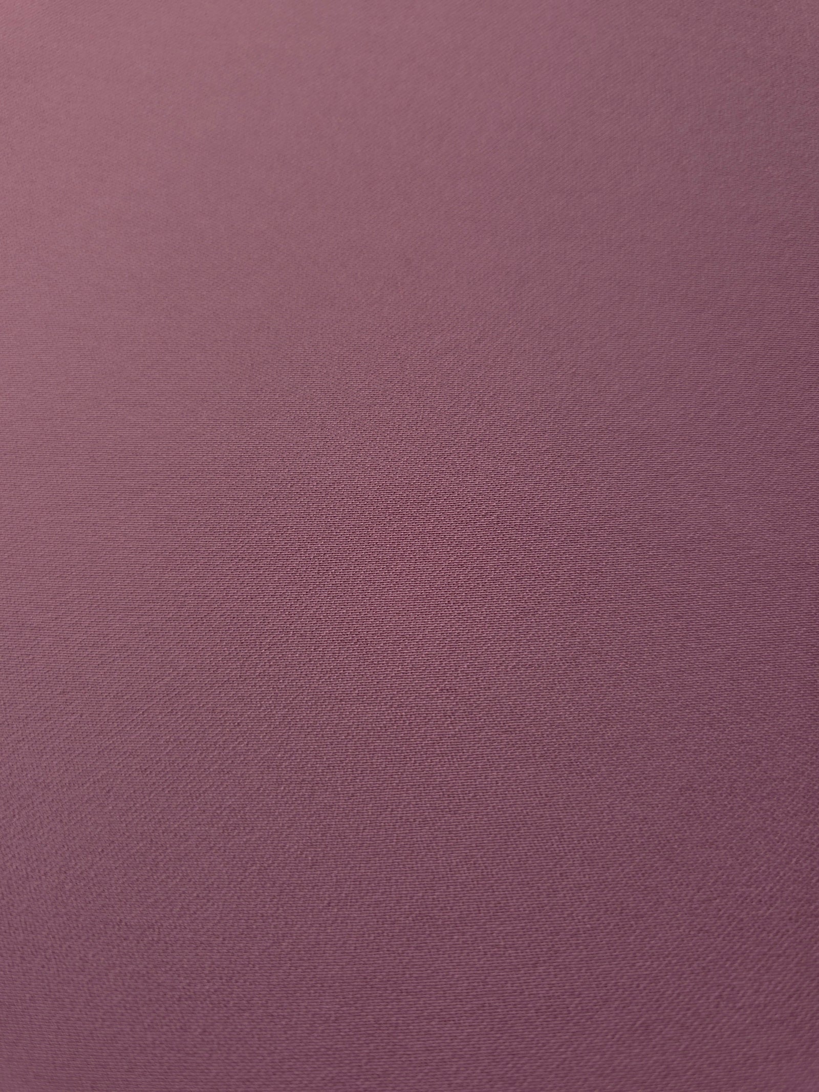 Dusty Mauve mechanical polyester crepe in close-up, showing fine woven texture and a silky-soft surface