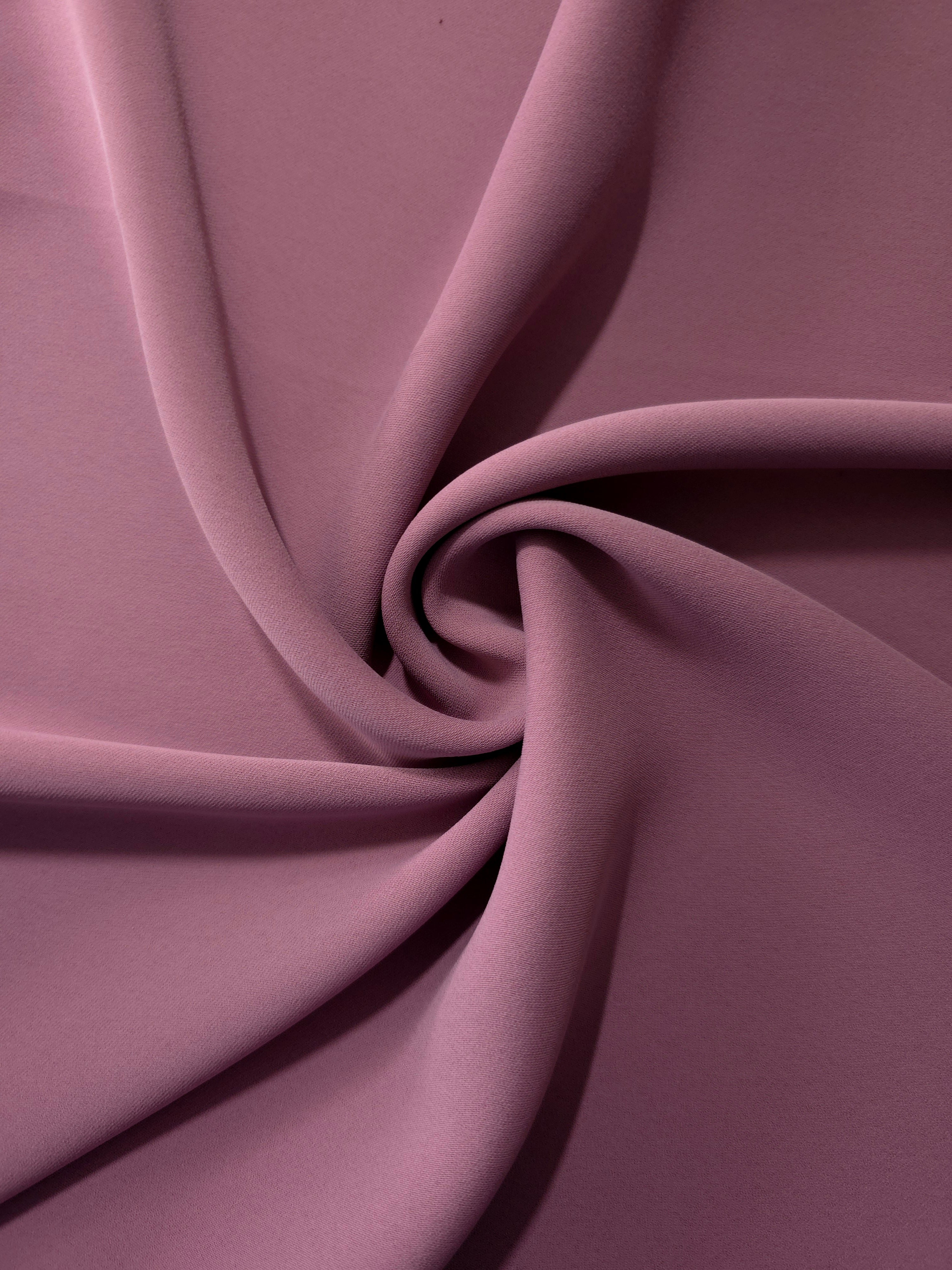 Dusty Mauve silky-soft polyester crepe styled in a swirl to show fluid dressmaking drape and movement