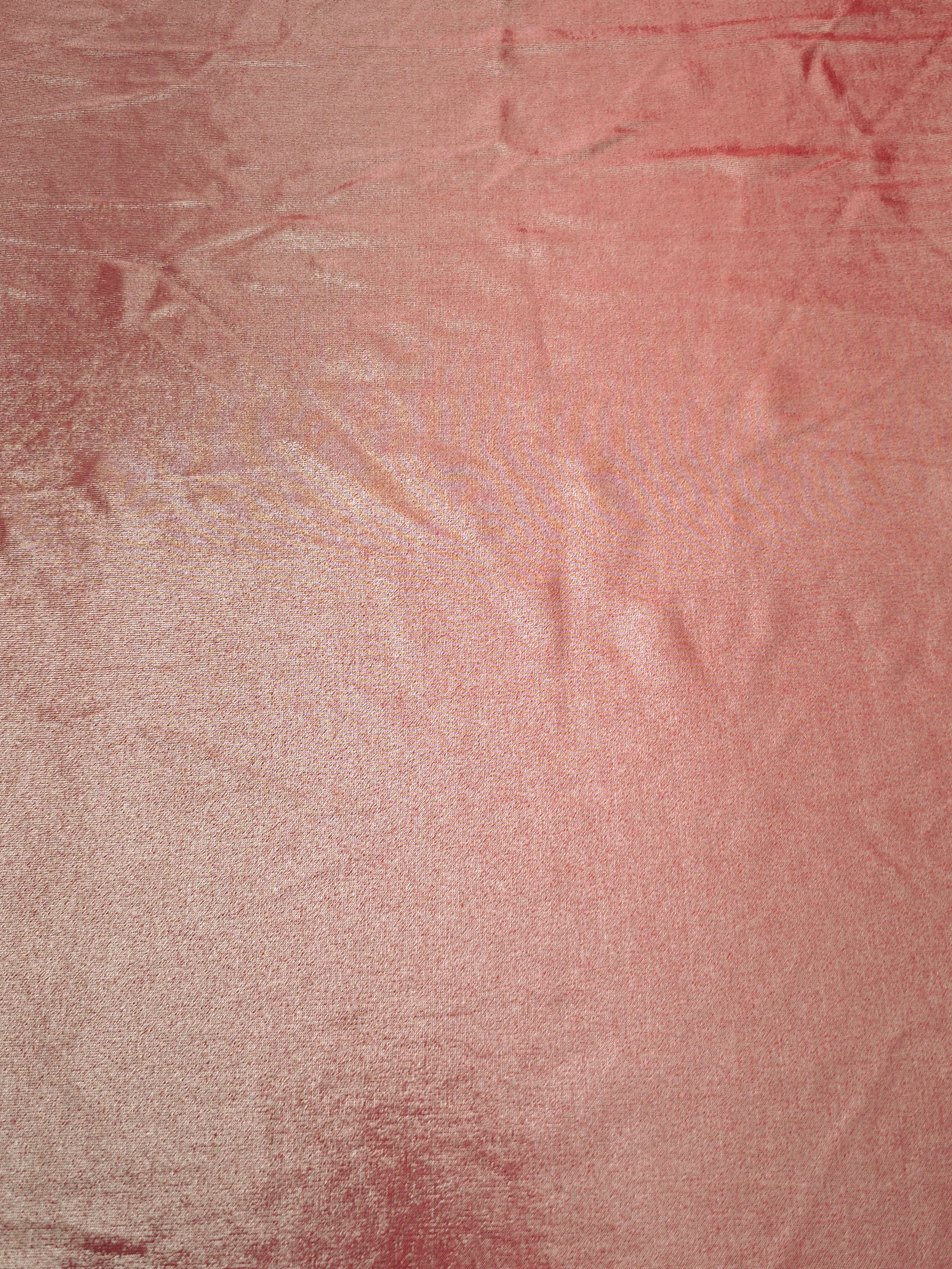 Flat Dusty Peach Pink foiled stretch fabric with bright metallic reflection, ideal for performancewear, evening pieces and creative sewing