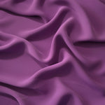 Dusty Plum Korean polyester dress fabric shown in draped folds for occasionwear, blouses and dresses