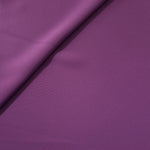 Close woven detail of Dusty Plum 100% polyester Korean crepe showing its smooth texture and soft finish