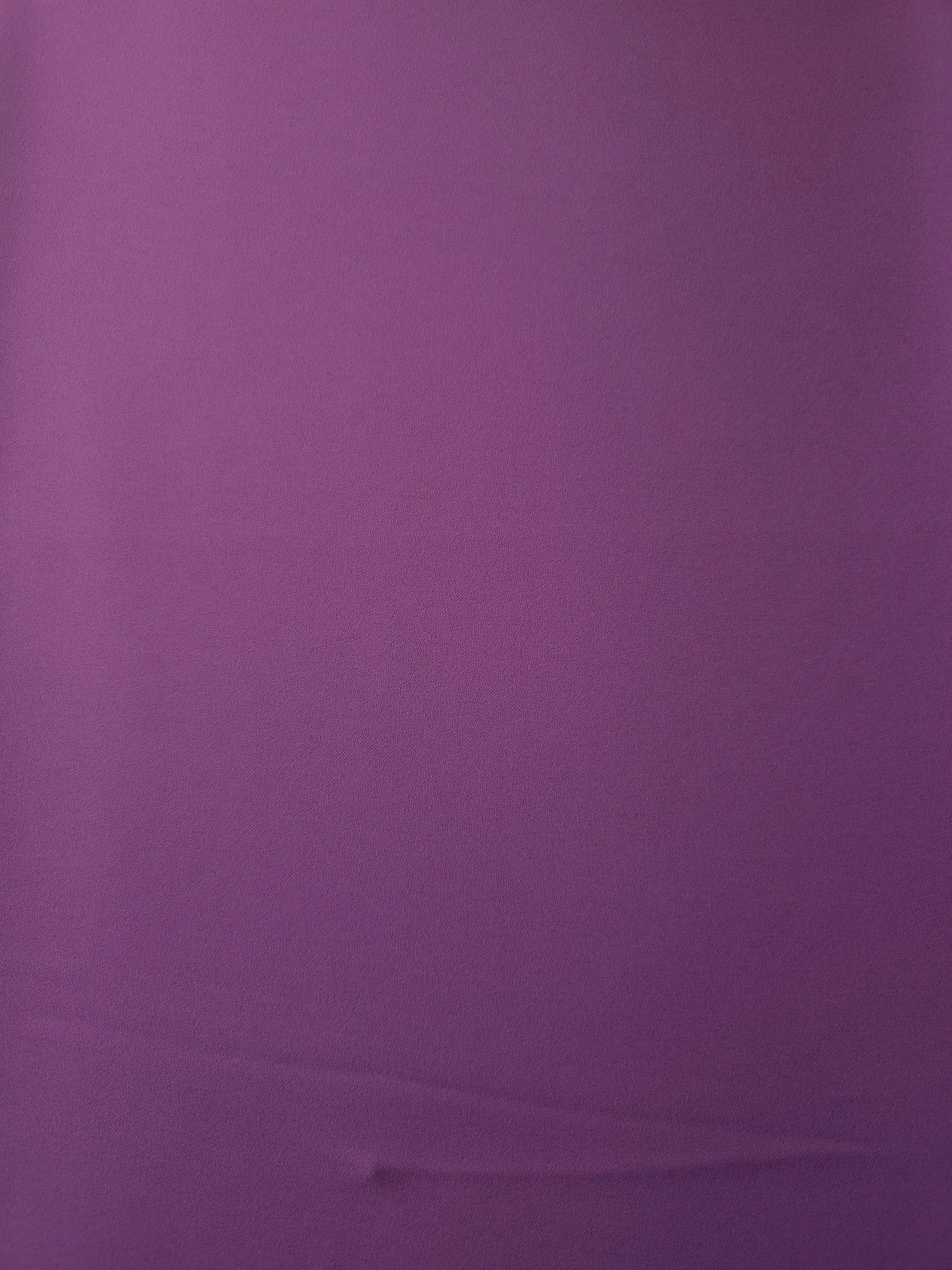 Surface view of Dusty Plum 205 GSM polyester crepe, opaque Korean dress fabric with a smooth woven finish
